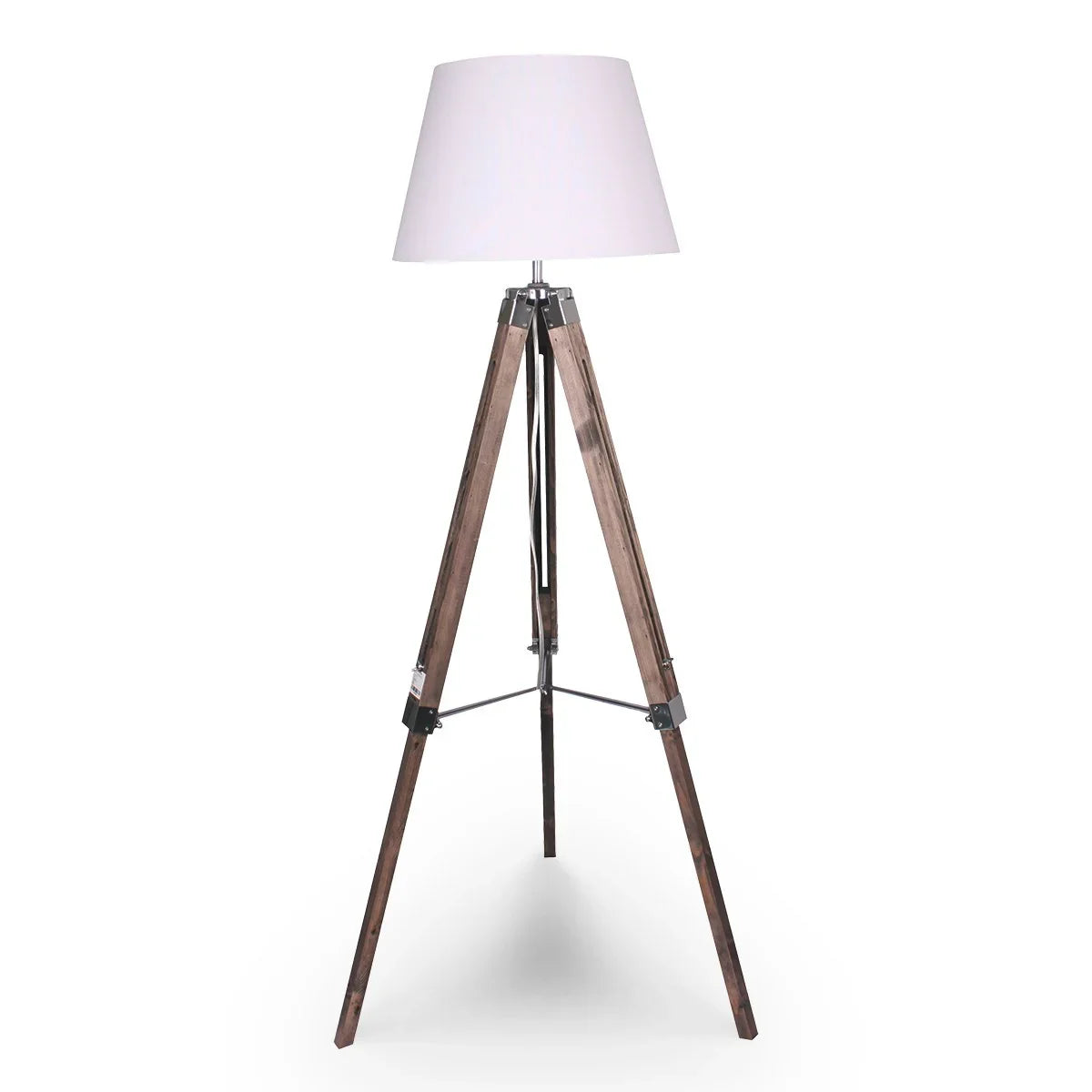 Modern tripod floor lamp with a white lampshade and wooden legs on white background