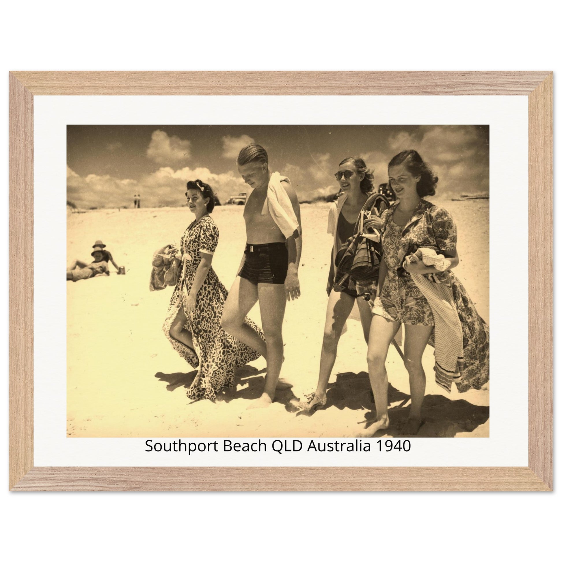 Vintage photo of four people on Southport Beach, QLD, Australia in 1940, framed with a wooden border.