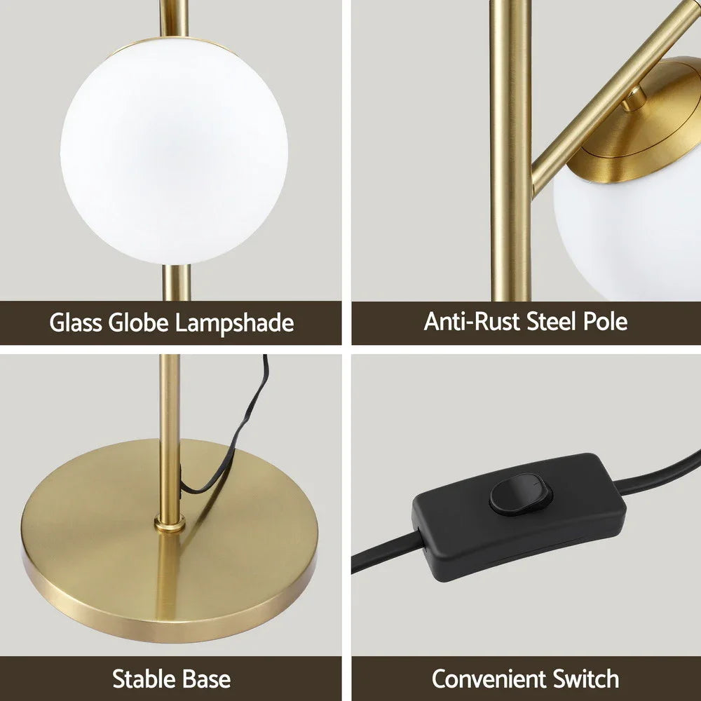 Modern floor lamp with glass globe lampshade, gold steel pole, stable base, and switch