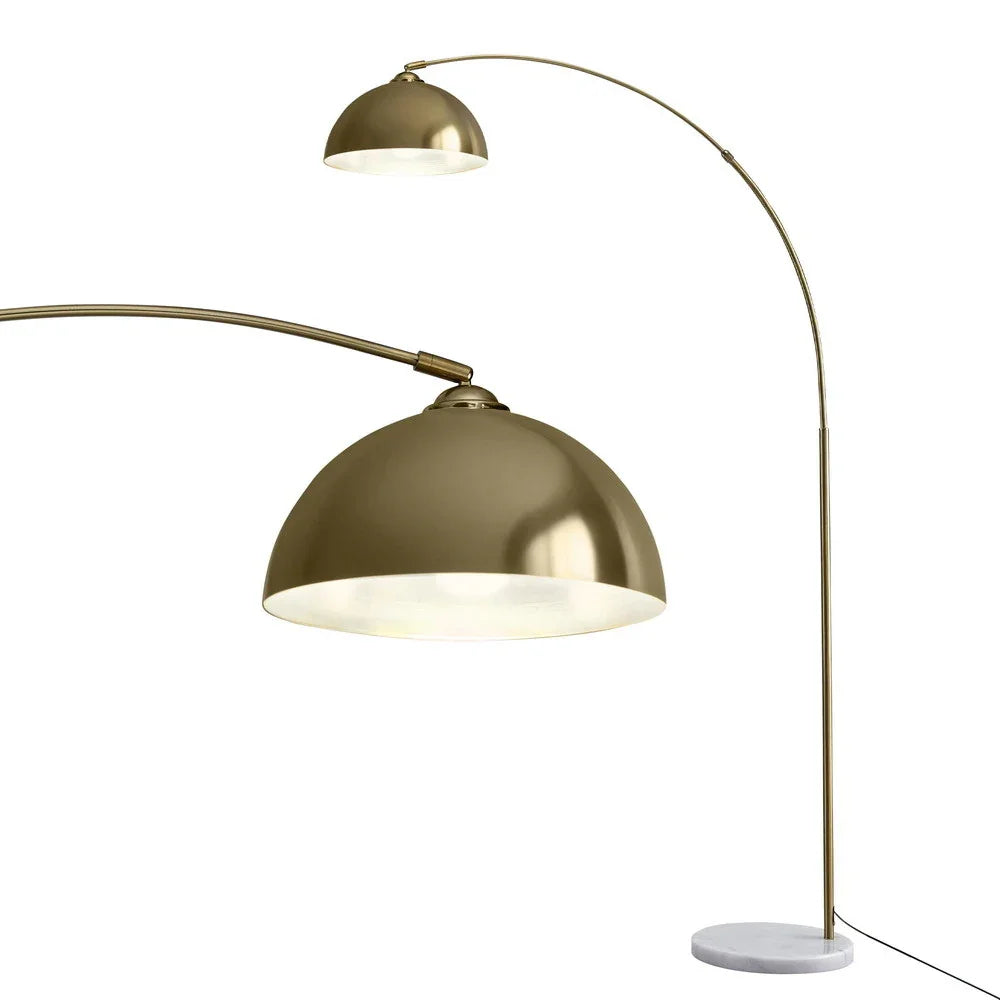Modern gold arc floor lamp with dome shade and white marble base