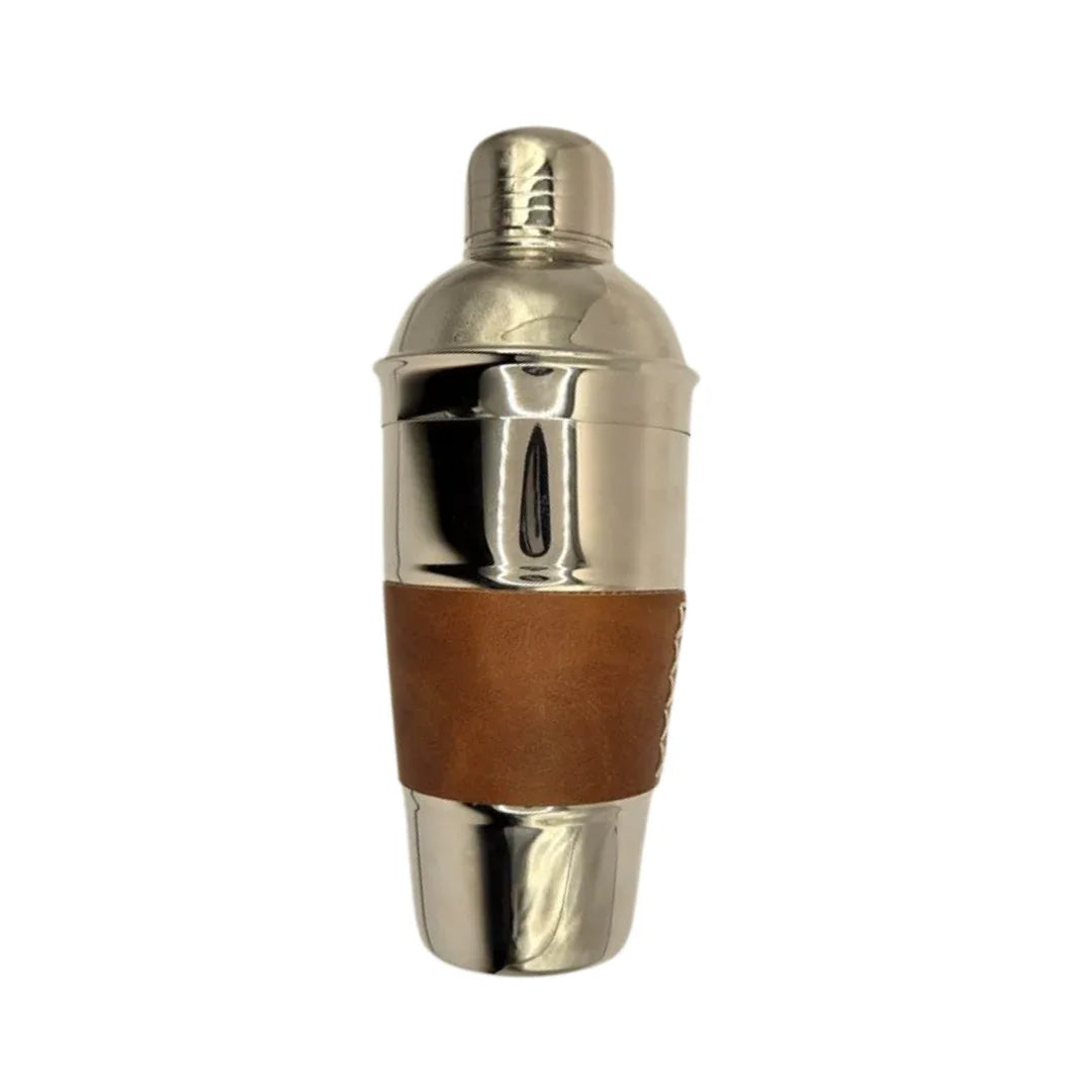 Stainless steel cocktail shaker with brown leather grip on white background