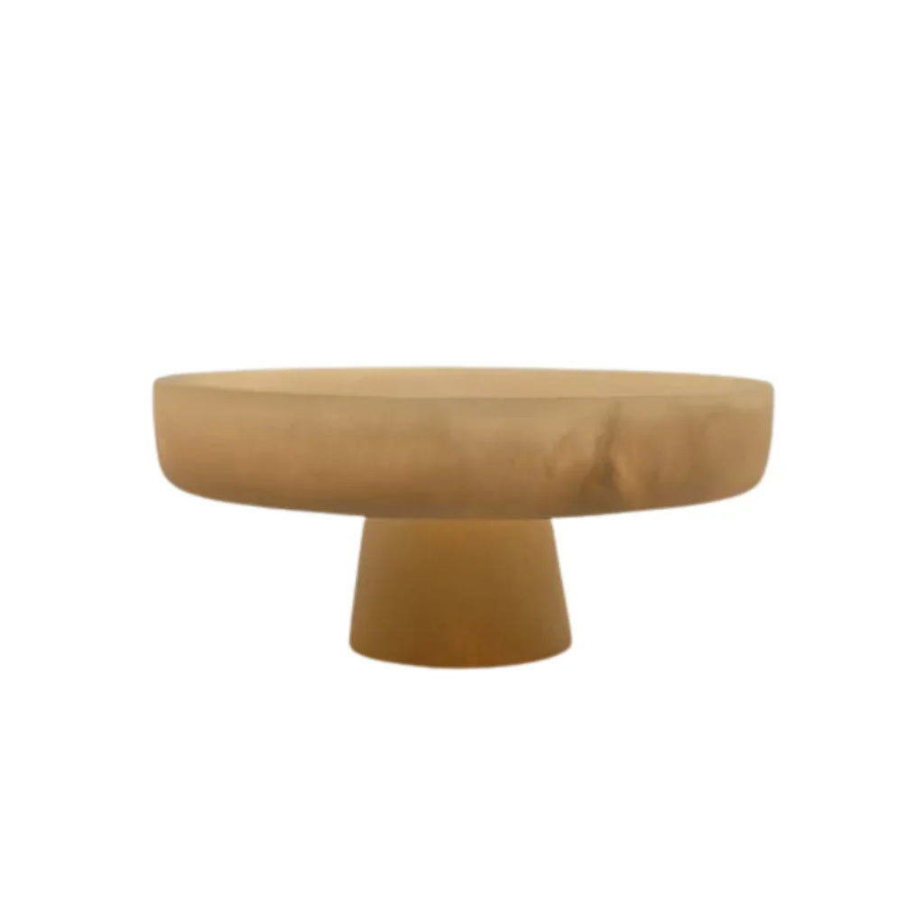 Modern round beige pedestal table with a smooth, minimalist design on white background