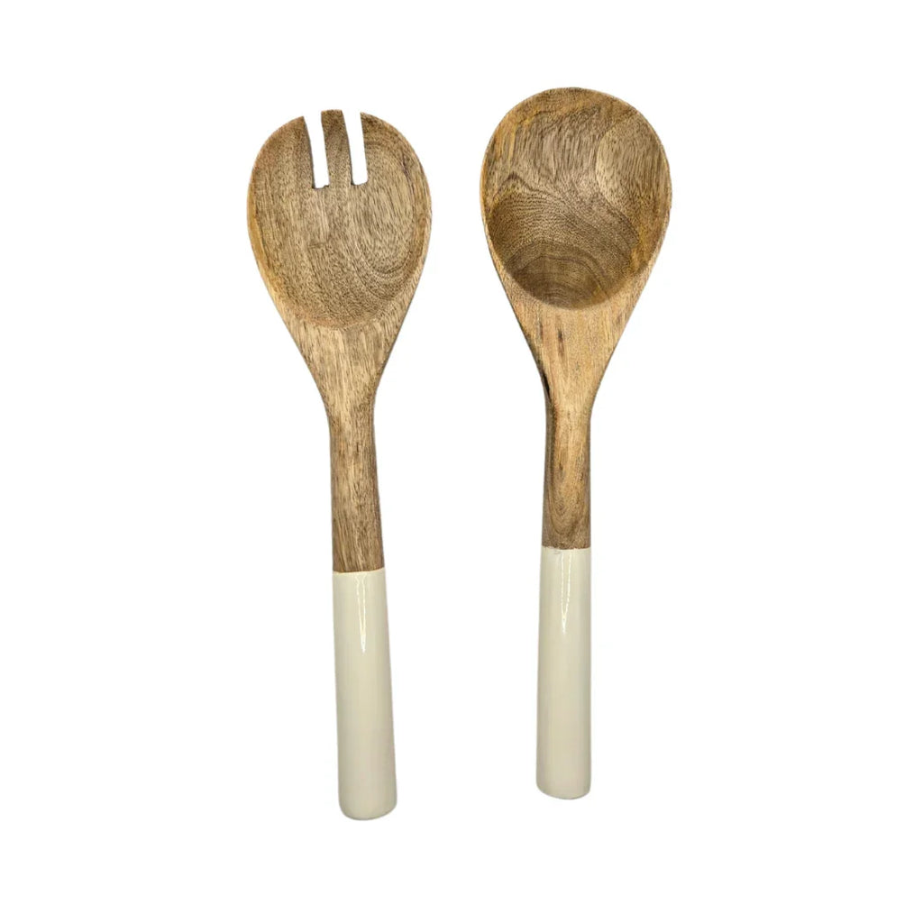Wooden salad serving spoons with white dipped handles on white background