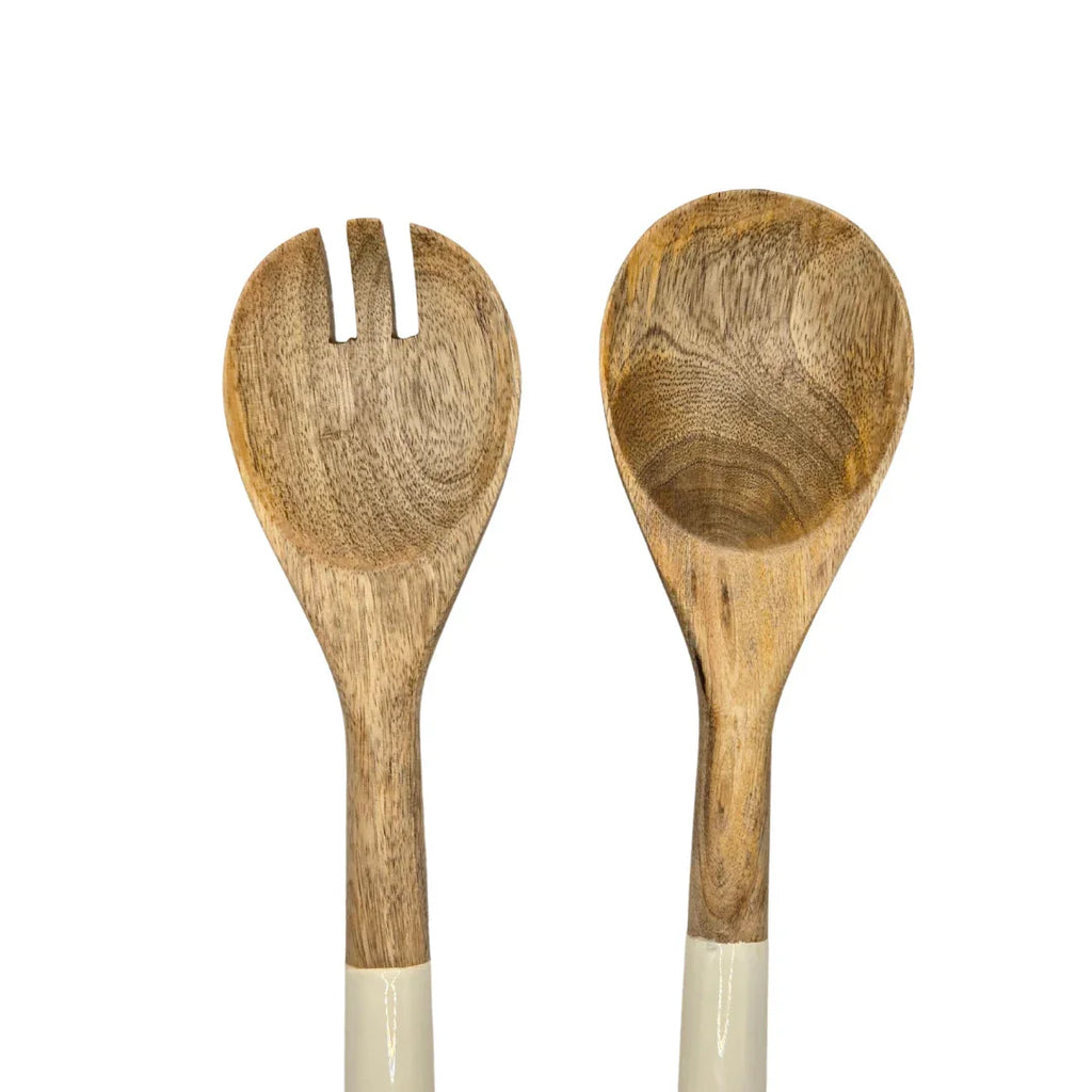 Wooden salad serving spoon and fork set with cream handles on white background