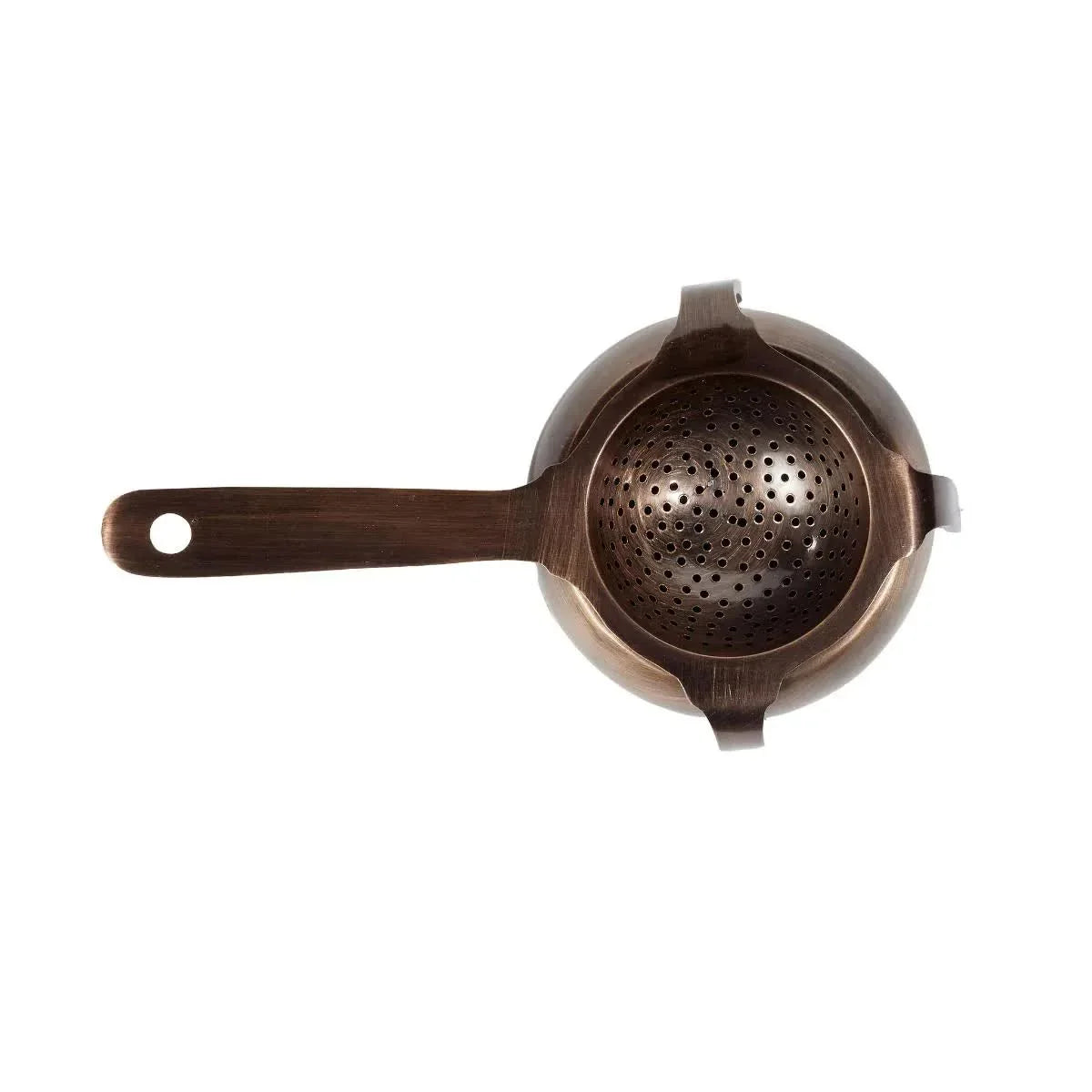 Bronze metal cocktail strainer with handle, viewed from above, on white background