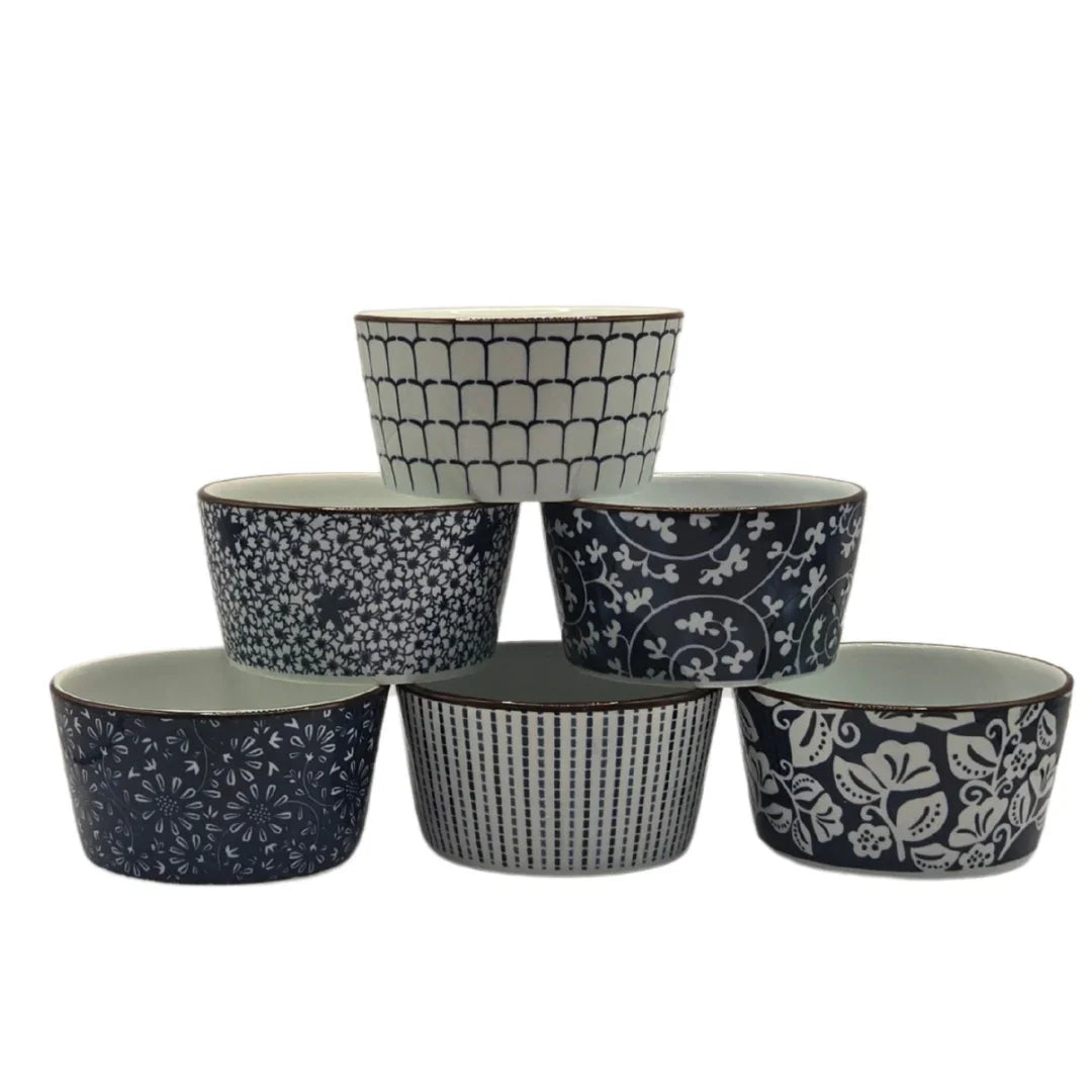 Set of five ceramic bowls with assorted blue and white floral and geometric patterns