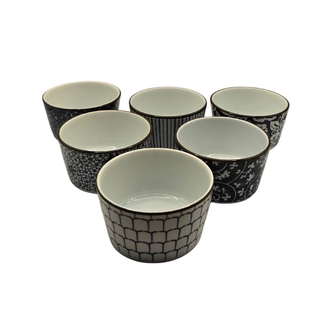 Set of six ceramic ramekins with assorted black and white geometric and floral patterns