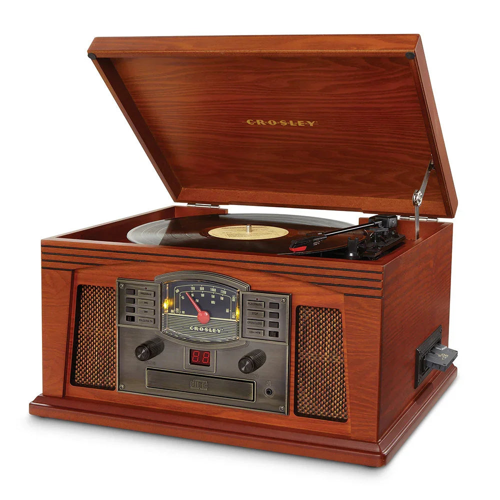 Crosley vintage wooden turntable with open lid, playing vinyl record, classic retro design