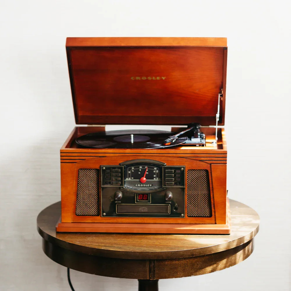 Vintage Crosley wooden record player on a round wooden table
