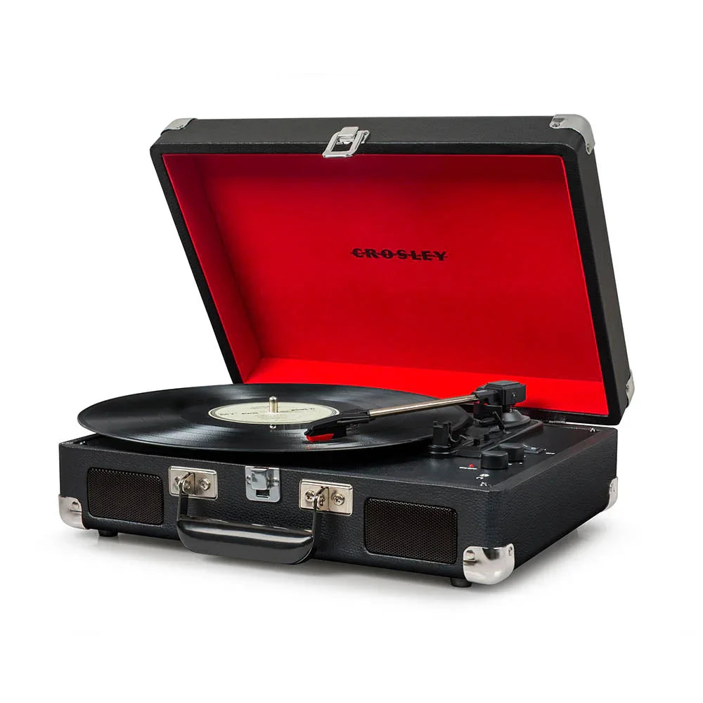 Crosley black portable suitcase record player with vinyl on white background