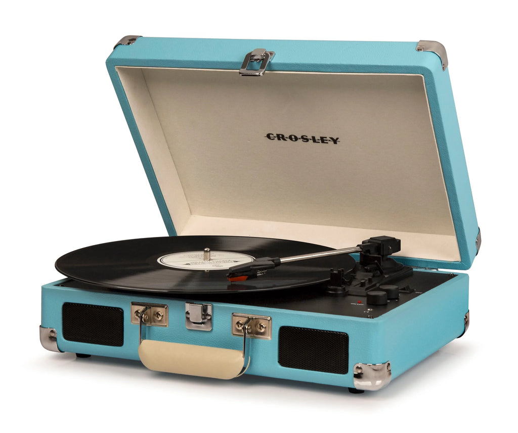 Crosley turquoise portable record player with open lid and vinyl record on turntable