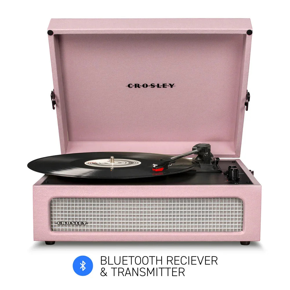 Pink Crosley Bluetooth record player with vinyl spinning, front view