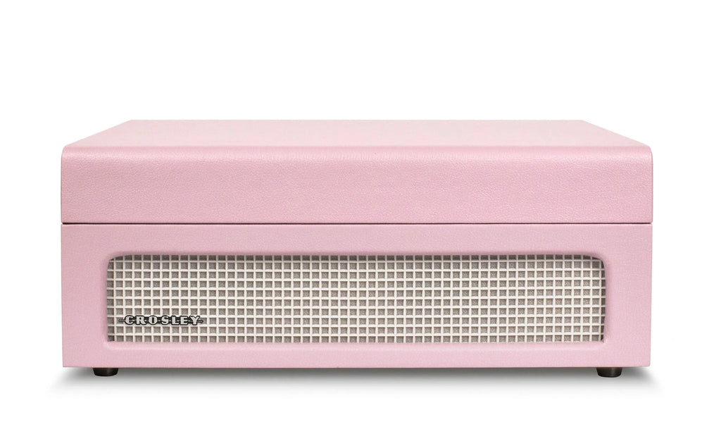 Pink Crosley retro speaker with front grille on white background