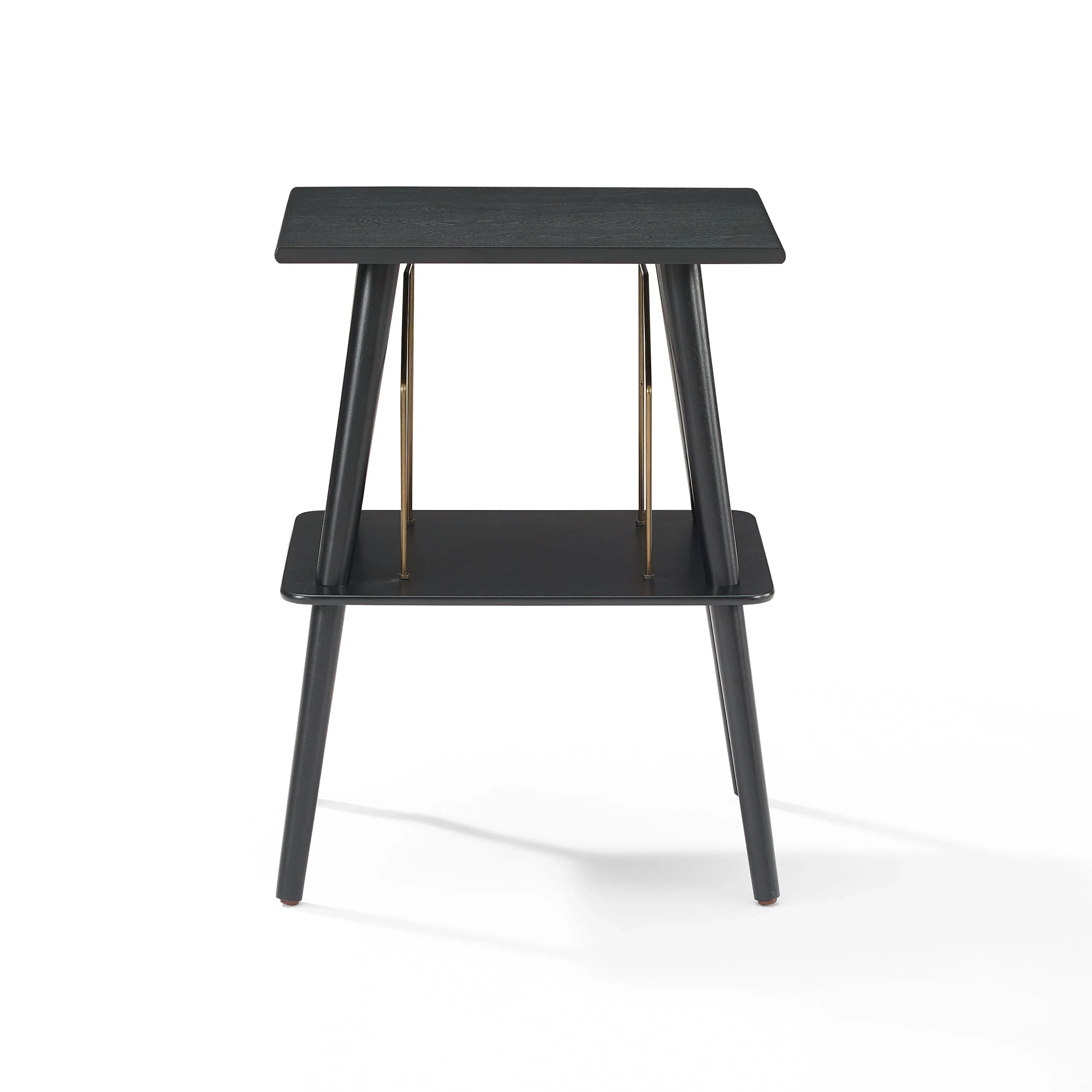 Modern black wooden side table with two tiers and gold metal accents on white background