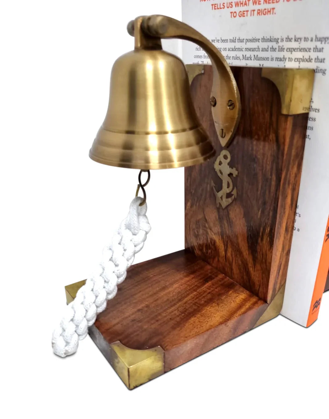 Nautical brass bell on wooden bookend with anchor motif and white braided rope