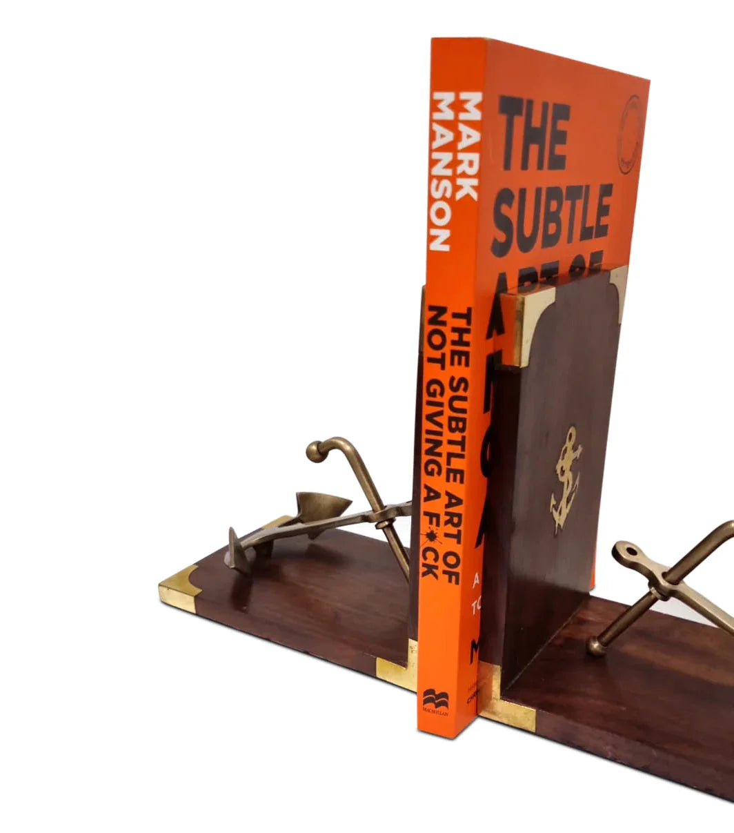 The Subtle Art of Not Giving a F*ck book on wooden nautical anchor bookends