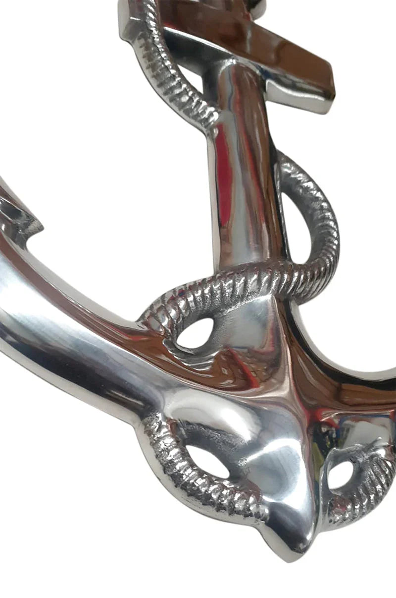 Shiny silver metal anchor decor with rope detail on white background