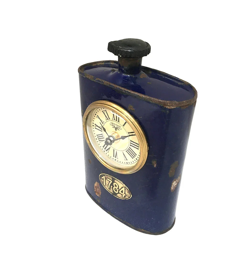 Vintage blue metal flask-style desk clock with Roman numerals and 1784 emblem