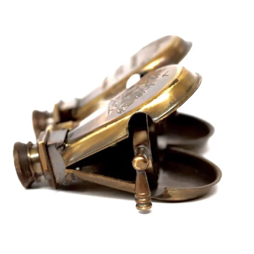 Vintage brass candle wick trimmer with scissor blades on white background