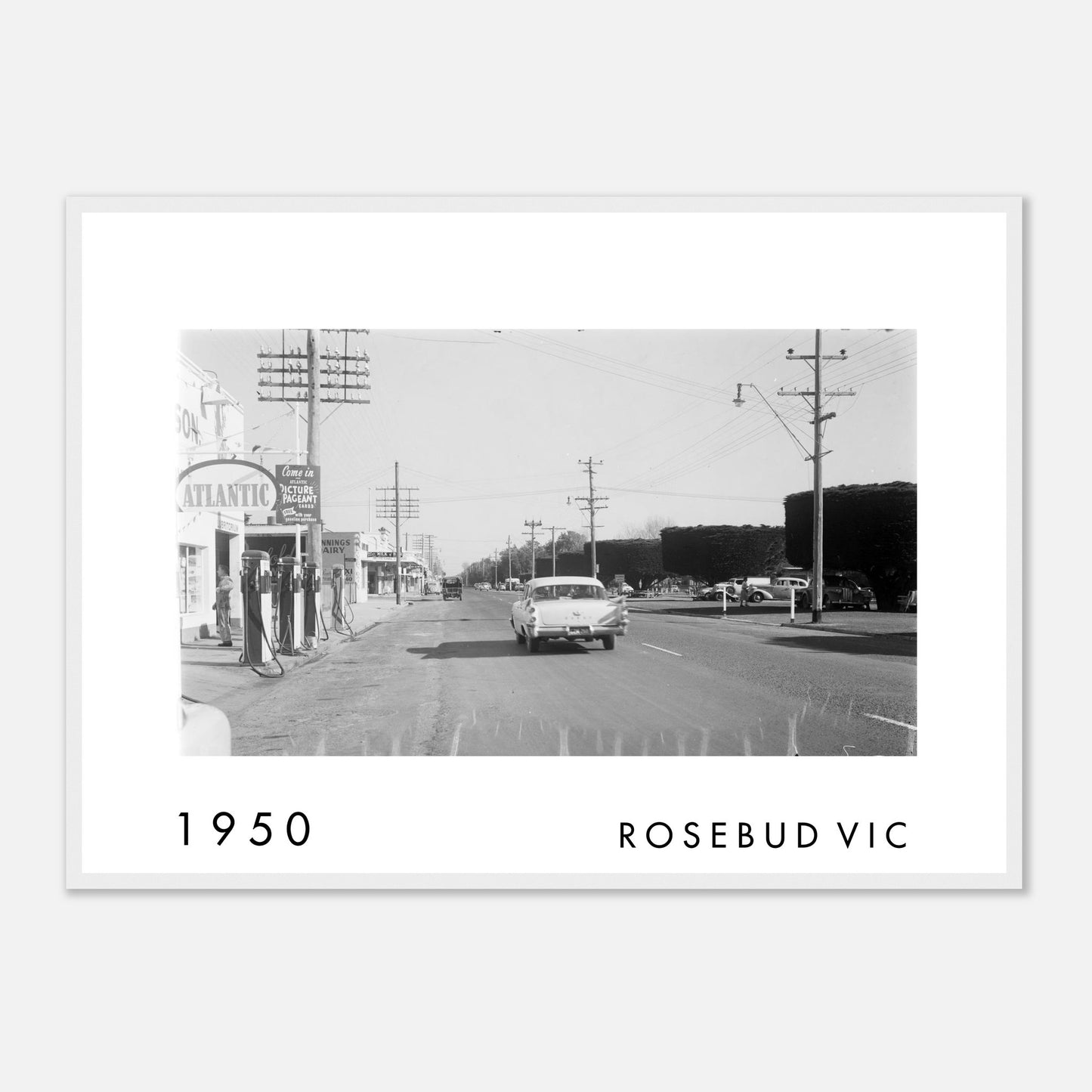 Vintage 1950s view of Nepean Highway in Rosebud, Victoria, featuring classic cars, the Atlantic service station and roadside businesses on the Mornington Peninsula.